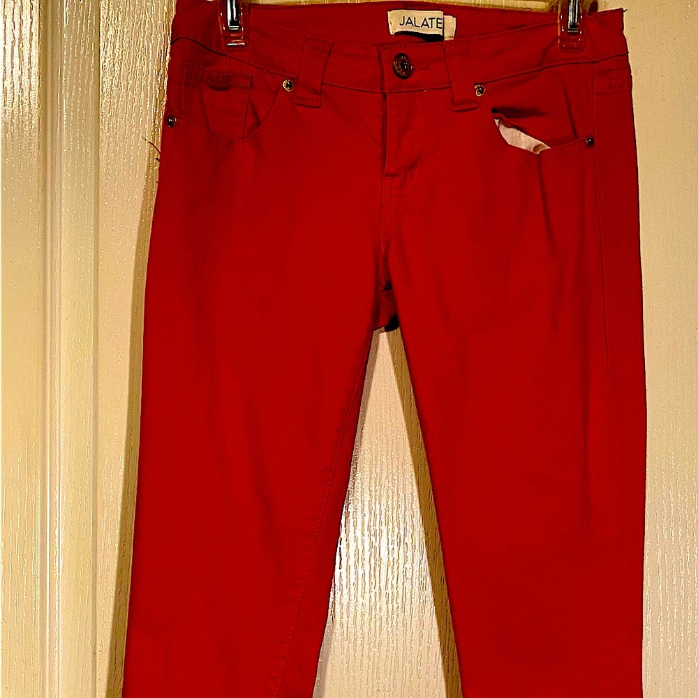 Women’s pair of  dk orange jeans . Size 5  made by Jalate jeanss